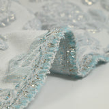 Brocart polyester rosier fond bleu givré