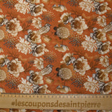 Viscose printed with chrysanthemums on a burnt orange background