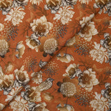 Viscose printed with chrysanthemums on a burnt orange background