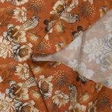 Viscose printed with chrysanthemums on a burnt orange background