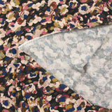 Maille polyester imprimée pluralité rose et bleu fond noir