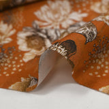 Viscose printed with chrysanthemums on a burnt orange background