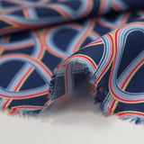 Viscose printed rainbow swirl navy background