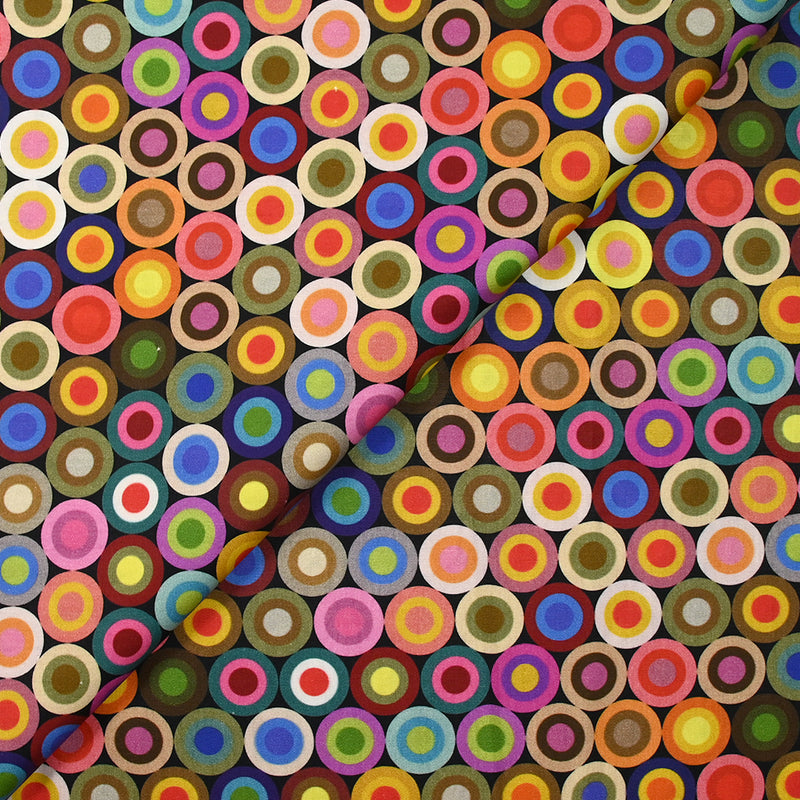 Coton imprimé cercles des sixties multicolore fond noir