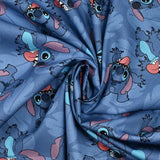 Coton imprimé Stitch fond bleu barbeau