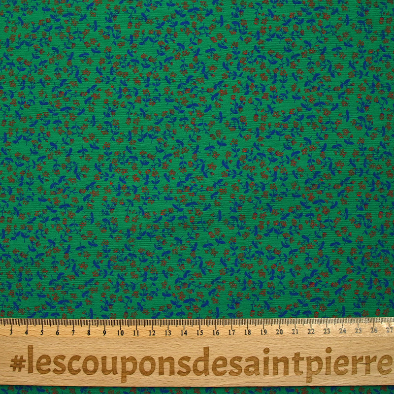 Viscose imprimée texturée mini fleurs fond vert