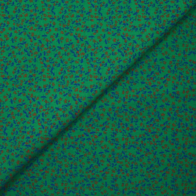 Viscose imprimée texturée mini fleurs fond vert