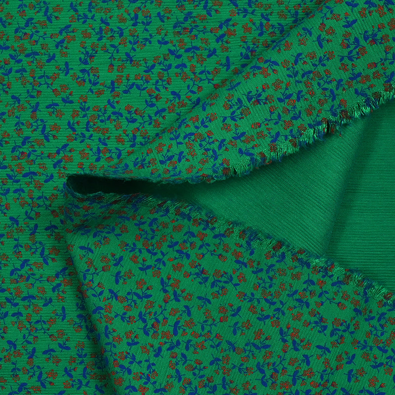 Viscose imprimée texturée mini fleurs fond vert