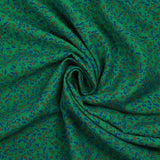 Viscose imprimée texturée mini fleurs fond vert