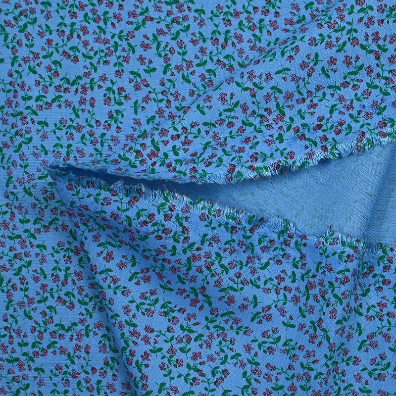 Viscose imprimée mini fleurs fond bleu