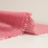 Coton tissé teint pied-de-puce rouge