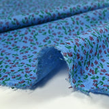 Viscose imprimée mini fleurs fond bleu