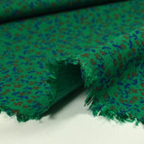Viscose imprimée texturée mini fleurs fond vert