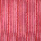 Voile de viscose et laine imprimé aztèque rouge fond rose