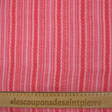 Voile de viscose et laine imprimé aztèque rouge fond rose