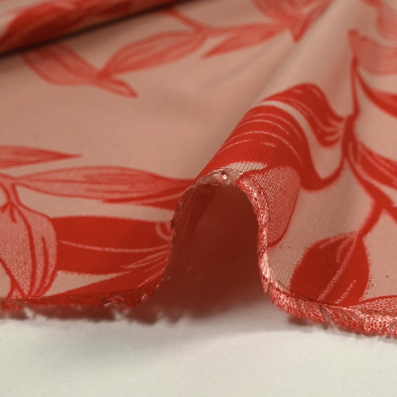 Polyviscose imprimée jungle flower rouge fond rose