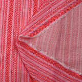 Voile de viscose et laine imprimé aztèque rouge fond rose