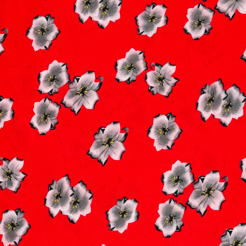 Viscose imprimée fleurs de cerisier fond rouge