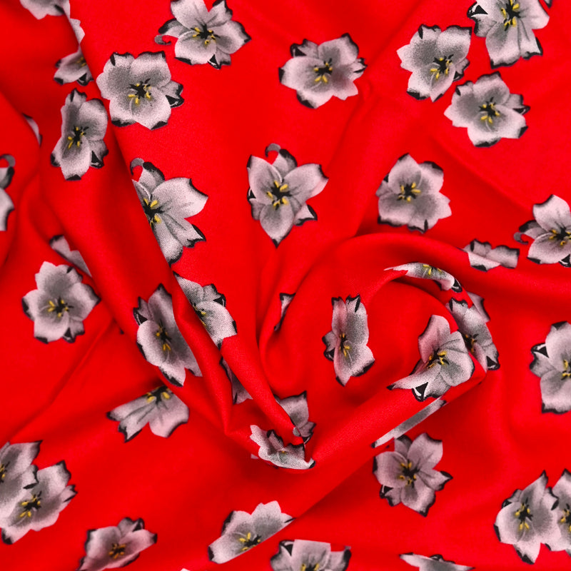 Viscose imprimée fleurs de cerisier fond rouge