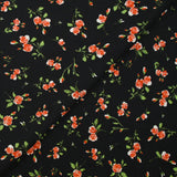 Maille Milano imprimée pluie de roses fond noir