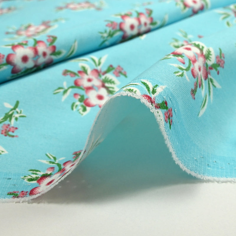 Sergé de coton imprimé petites fleurs fond azur