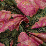 Golden brocade with pink flowers green background