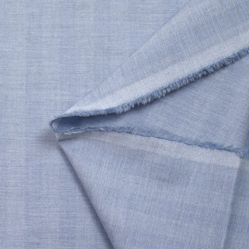 Coton tissé teint rayé chevrons bleu ciel chiné