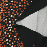 Jersey de coton imprimé évasion de pois noir, rouille et sable