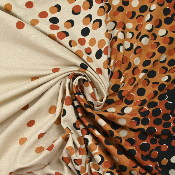 Jersey de coton imprimé évasion de pois noir, rouille et sable