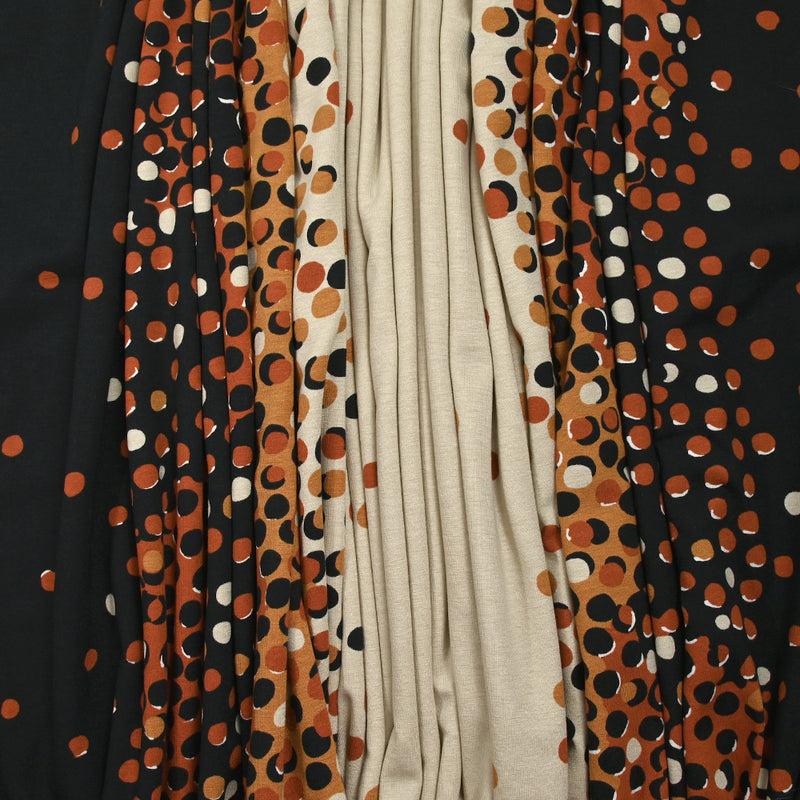 Jersey de coton imprimé évasion de pois noir, rouille et sable