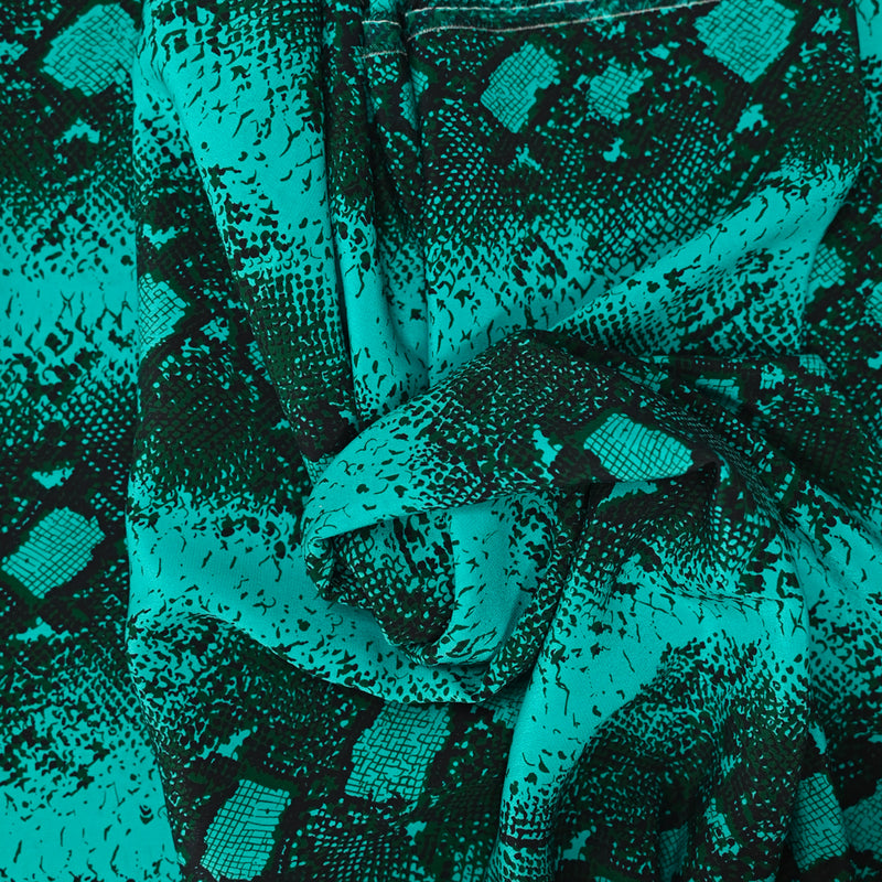 Crêpe de chine en soie imprimé serpent fond turquoise
