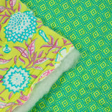 Coton matelassé double face ethnique et fleurs vert anis au mètre