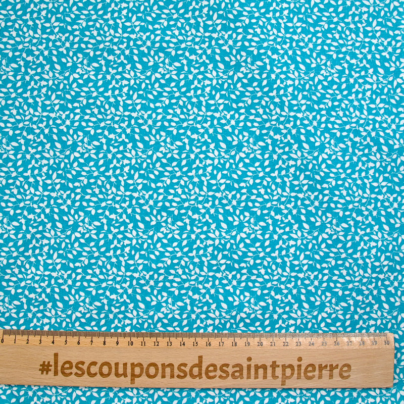 Popeline de coton imprimée feuillage fond turquoise