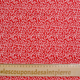 Popeline de coton imprimée feuillage fond rouge