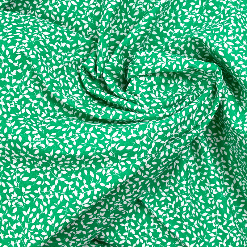 Cotton poplin printed foliage green background