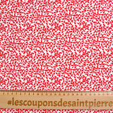 Popeline de coton imprimée feuillage rouge fond blanc