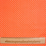 Popeline de coton imprimée coquillage fond orange