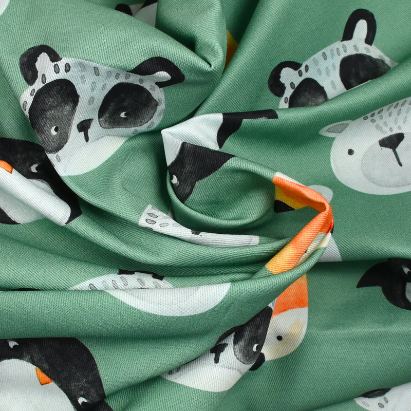 Gabardine de coton imprimé animaux fond vert