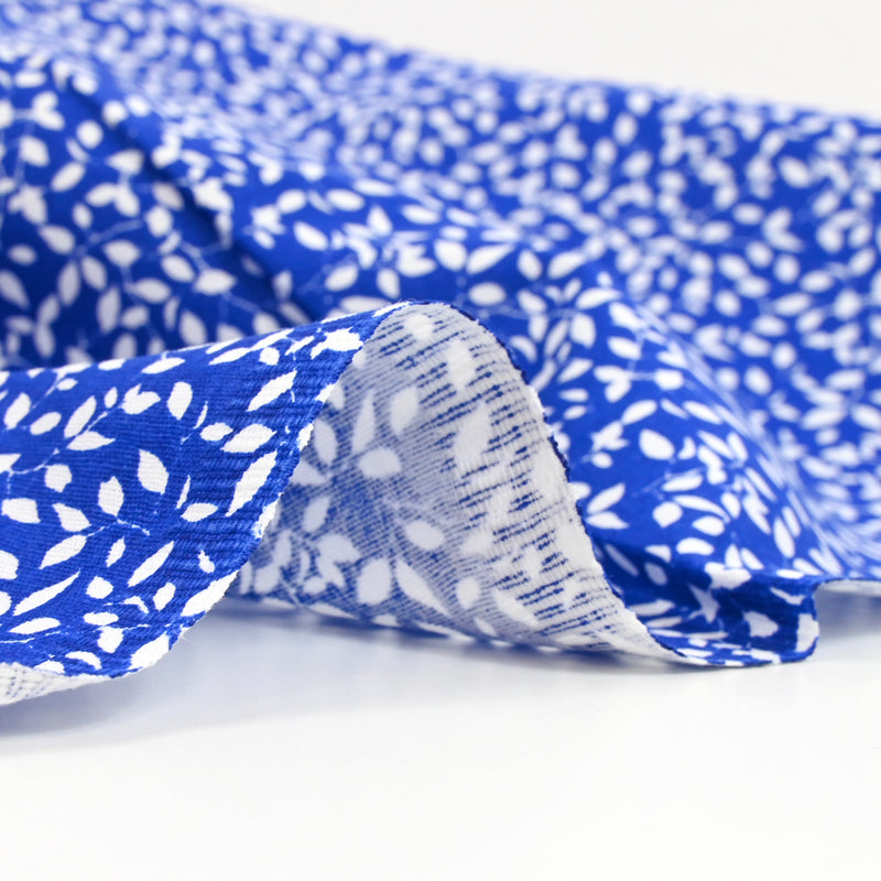 Cotton poplin printed blue background foliage