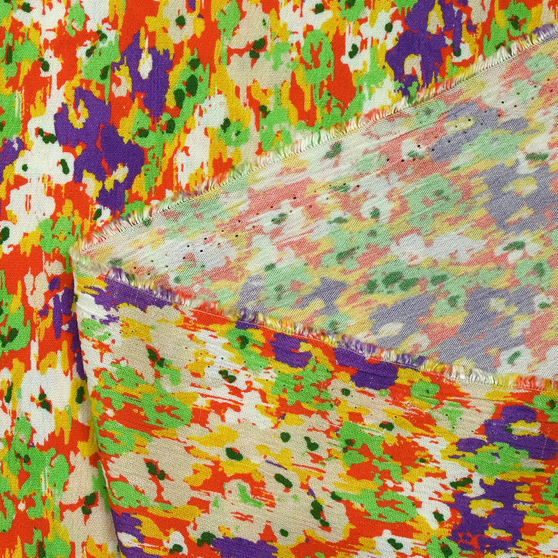 Crépon de viscose imprimé pensée floue violet et vert fond orange
