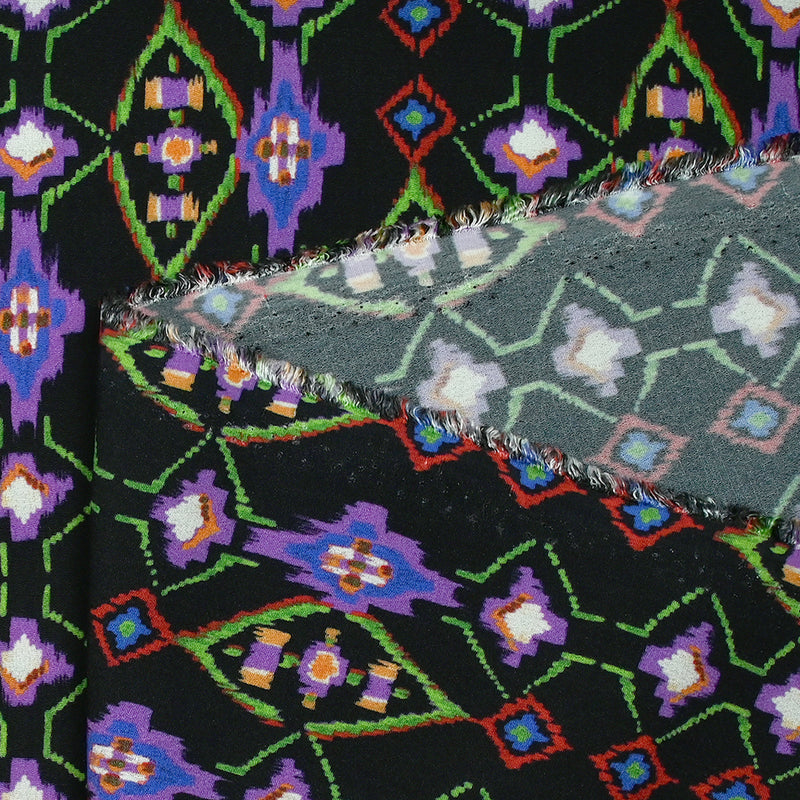 Crêpe viscose imprimé éclat mystique violet et vert fond noir