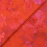 Jacquard de viscose satiné imprimé taches florales fond orange