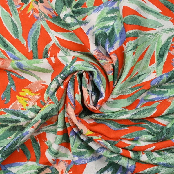 Viscose imprimée feuilles vert d'eau fond orange