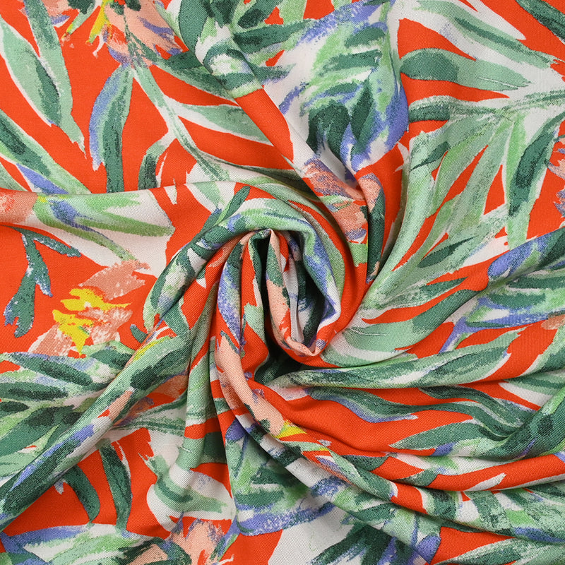 Viscose imprimée feuilles vert d'eau fond orange