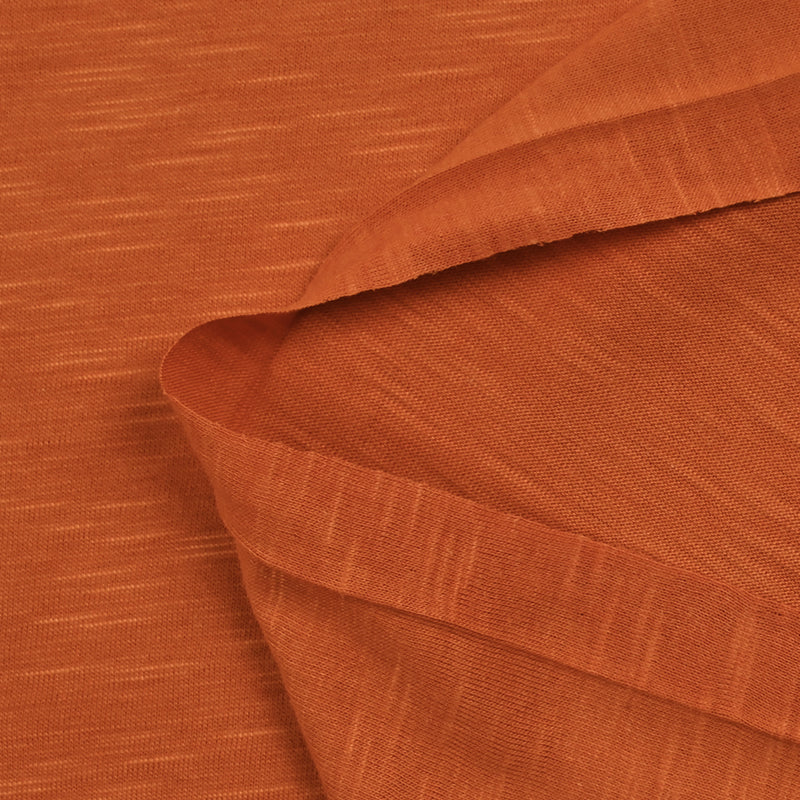 Flammed orange viscose jersey burned