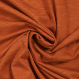 Flammed orange viscose jersey burned