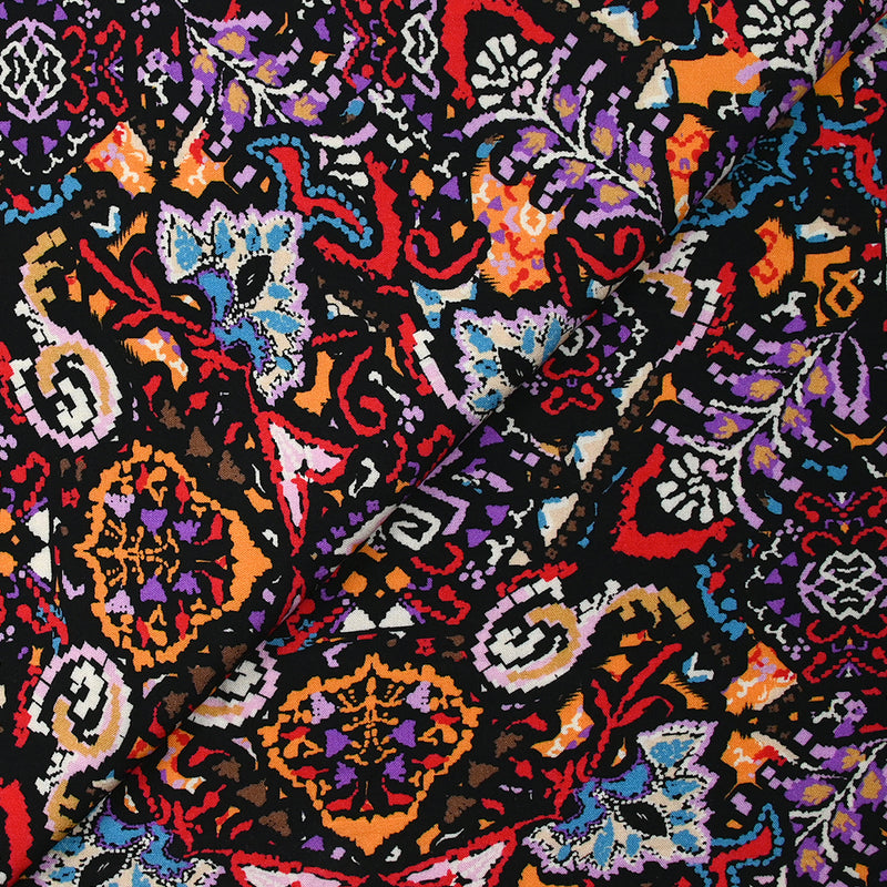 Viscose imprimée frénésie orange, rouge et violet fond noir