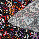 Viscose imprimée frénésie orange, rouge et violet fond noir