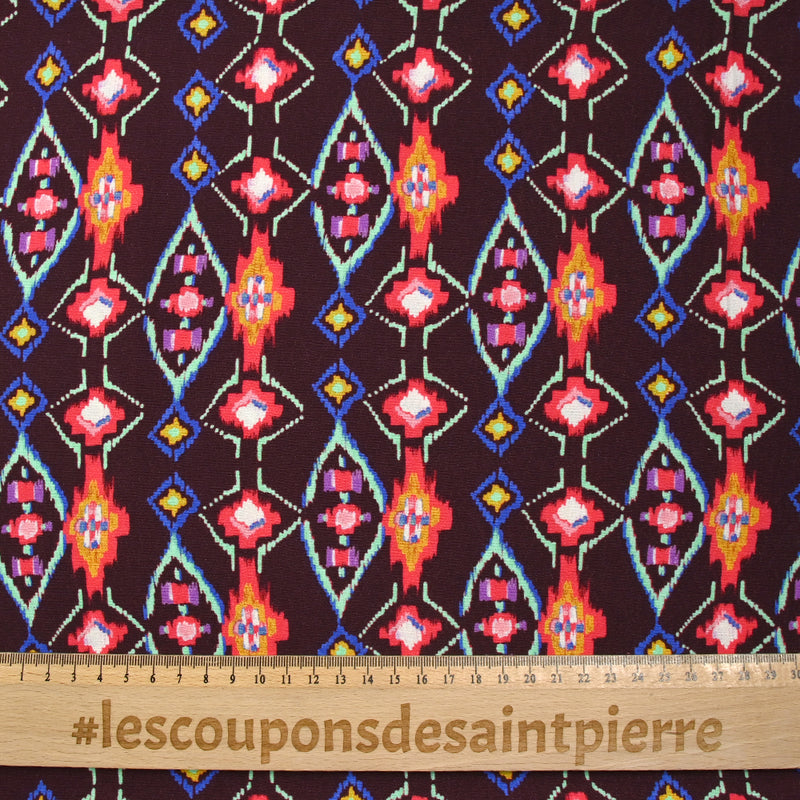 Crêpe viscose imprimé éclat mystique fuchsia et vert d'eau fond lie de vin