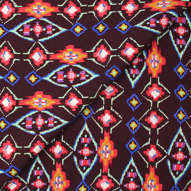 Crêpe viscose imprimé éclat mystique fuchsia et vert d'eau fond lie de vin